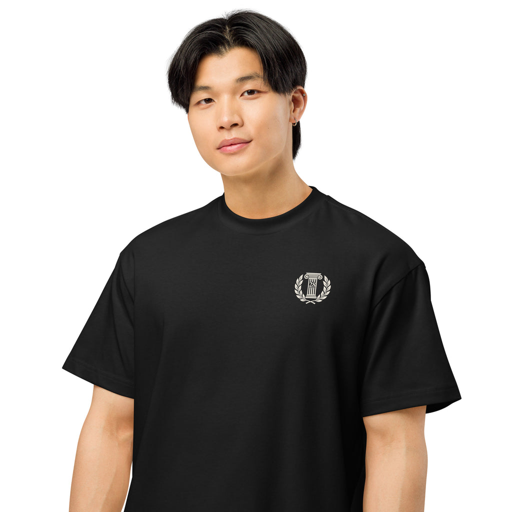 Person wearing a black t-shirt with a logo on a white background
